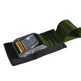 Close up product photo of an olive drab tie down cam strap featuring a rollercam buckle, sewn gear loop, and buckle pad made from black seatbelt webbing.