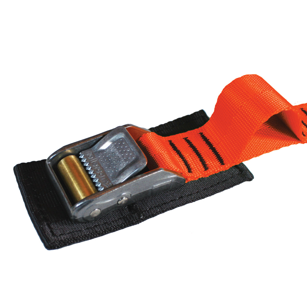 Close up product photo of a red-orange tie down cam strap featuring a rollercam buckle, sewn gear loop, and buckle pad made from black seatbelt webbing.