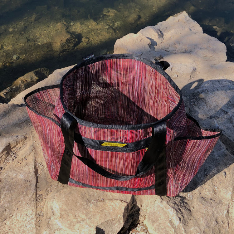 Multi-mesh (Red) tote bag on rock